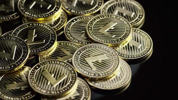 Rotating shot of Bitcoins (digital cryptocurrency) - BITCOIN LITECOIN 239
