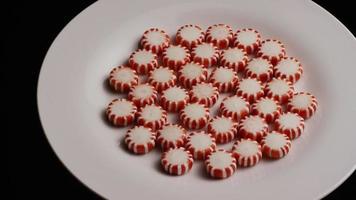 Rotating shot of peppermint candies - CANDY PEPPERMINT 026 video