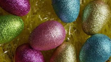 Rotating shot of Easter decorations and candy in colorful Easter grass - EASTER 012 video