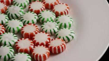 Rotating shot of spearmint hard candies - CANDY SPEARMINT 065