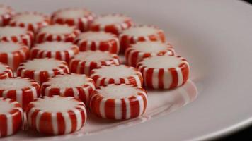 Rotating shot of peppermint candies - CANDY PEPPERMINT 041