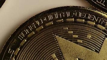 Rotating shot of Bitcoins (digital cryptocurrency) - BITCOIN MONERO 012