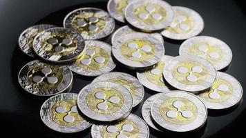 Rotating shot of Bitcoins digital cryptocurrency - BITCOIN RIPPLE 0110 video