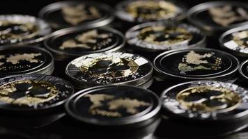 Rotating shot of Bitcoins digital cryptocurrency - BITCOIN RIPPLE 0172 video