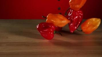 Peppers falling and bouncing in ultra slow motion 1,500 fps on a reflective surface - BOUNCING PEPPERS PHANTOM 006 video
