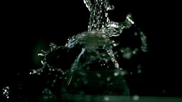 Water pouring from a faucet in ultra slow motion 1,500 fps on a reflective surface - WATER FAUCET 019 video