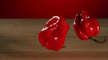 Peppers falling and bouncing in ultra slow motion (1,500 fps) on a reflective surface - BOUNCING PEPPERS PHANTOM 007 video
