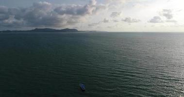 Top view of a blue boat sailing in the sea video