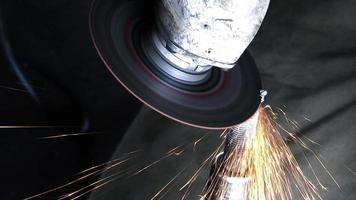 Close Up Grinding Machine Cuts Metal Screw