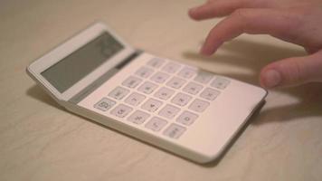 View of Person Typing On Calculator 4k video