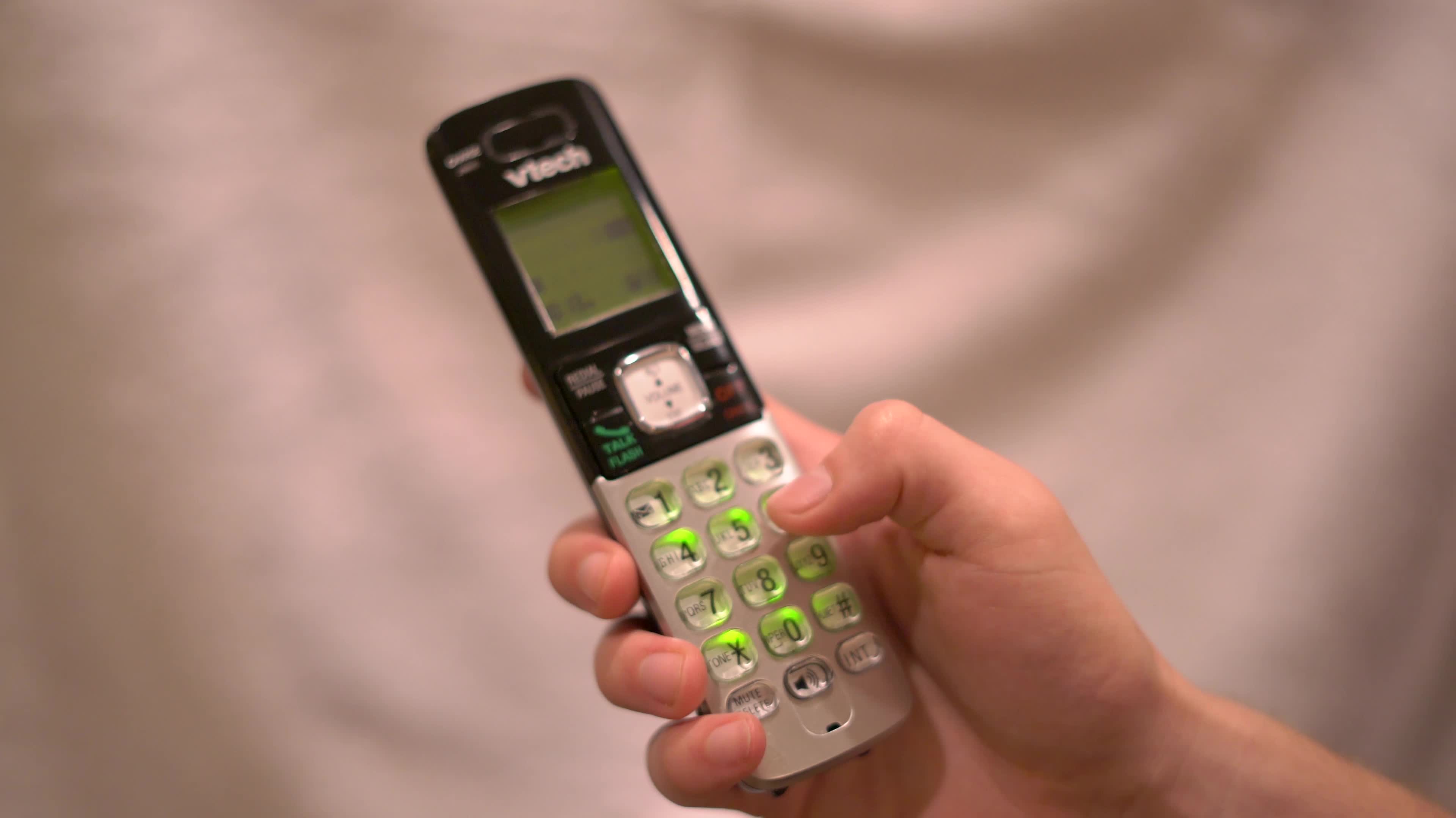 person-dialing-number-on-cordless-phone-4k-1798501-stock-video-at-vecteezy