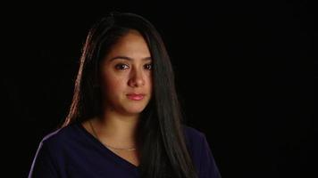 Dark Haired Girl Pensive Looks at Camera video