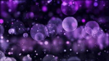 Purple bokeh lights with different sizes floating on dark background video