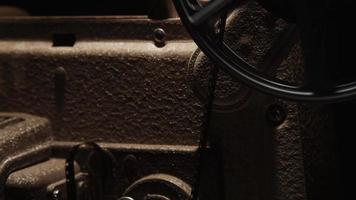 Close up of 8mm movie projector mechanism with film reel spinning in 4K video