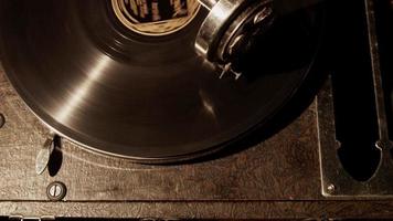  Static shot of half vinyl disc spinning on vintage record player in 4K video