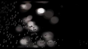 Extreme up of aquarium bubbles in glass with defocused bubbles in background in 4K
