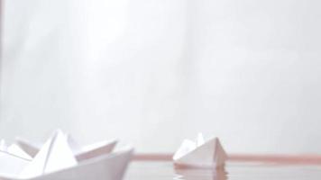 Group of paper boats moving from left to right. video