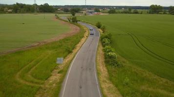 Two sports cars passing by in 4K video