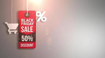 schwarzes Freitagszeichen, das an Schnur mit Einkaufswagen und Prozentikone hängt video