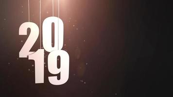 Happy New Year 2019 white paper numbers hanging on strings falling down black background video