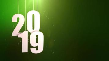 Feliz año nuevo 2019 números de papel blanco colgando de cuerdas cayendo fondo verde video