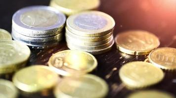 Euro coin on wooden table- financial power concept, closeup dolly shot video