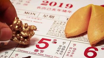 Close Up Of Man Placing A Little Piggy On Calendar video