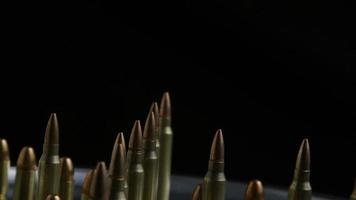 Cinematic rotating shot of bullets on a metallic surface - BULLETS 074 video