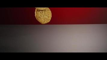 Falling cookies from above onto a reflective surface - COOKIES 212 video