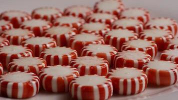 Rotating shot of peppermint candies - CANDY PEPPERMINT 042 video