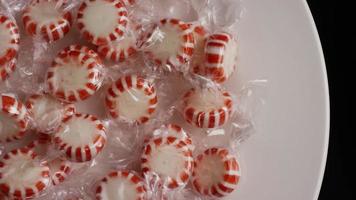 Rotating shot of peppermint candies - CANDY PEPPERMINT 002 video