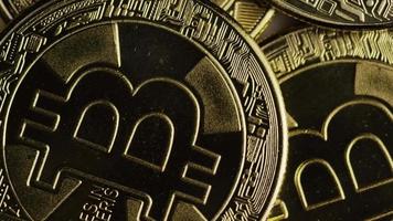 Rotating shot of Bitcoins digital cryptocurrency - BITCOIN 0292 video