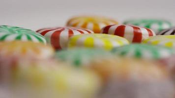 Rotating shot of a colorful mix of various hard candies - CANDY MIXED 038 video