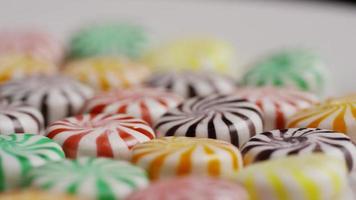 Rotating shot of a colorful mix of various hard candies - CANDY MIXED 032 video