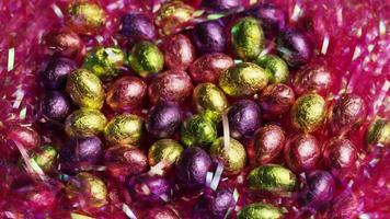 Rotating shot of colorful Easter candies on a bed of easter grass - EASTER 207 video