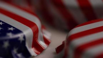 Rotating shot of bottle caps with the American flag printed on them - BOTTLE CAPS 045 video