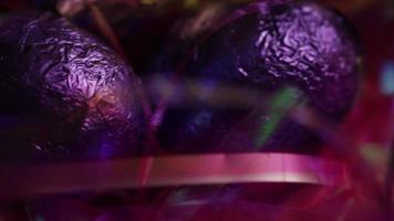 Rotating shot of colorful Easter candies on a bed of easter grass - EASTER 214 video