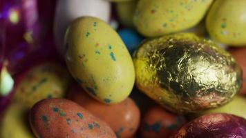 Rotating shot of colorful Easter candies on a bed of easter grass - EASTER 168 video