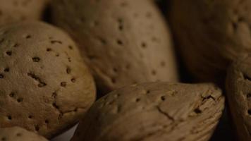 Cinematic, rotating shot of almonds on a white surface - ALMONDS 090 video