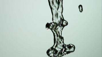 Water pouring and splashing in ultra slow motion 1,500 fps on a reflective surface - WATER POURS 127 video