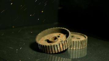 Sparks with gears in ultra slow motion 1,500 fps on a reflective surface - SPARKS w GEARS 003 video