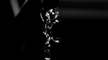 Water pouring from a faucet in ultra slow motion 1,500 fps on a reflective surface - WATER FAUCET 004 video