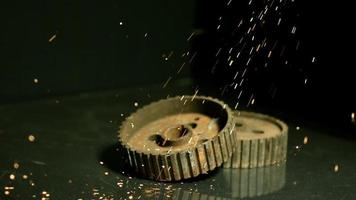 Sparks with gears in ultra slow motion 1,500 fps on a reflective surface - SPARKS w GEARS 001 video