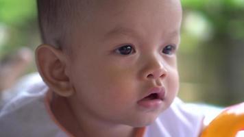 Happy portrait baby boy playing alone  video