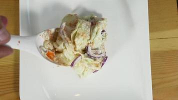 Top view of Health young chef tossing a tasty organic green salad. video