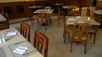 View of room with served tables in restaurant in hotel video