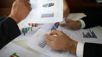 Businessmen in a meeting discussing results as a team. video