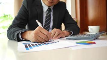 Businessman hands doing analysis planning business project in office. video