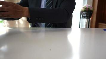 Businessman signing business contract on paper documents. video