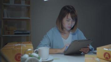 Businesswoman checking product on stock online  video